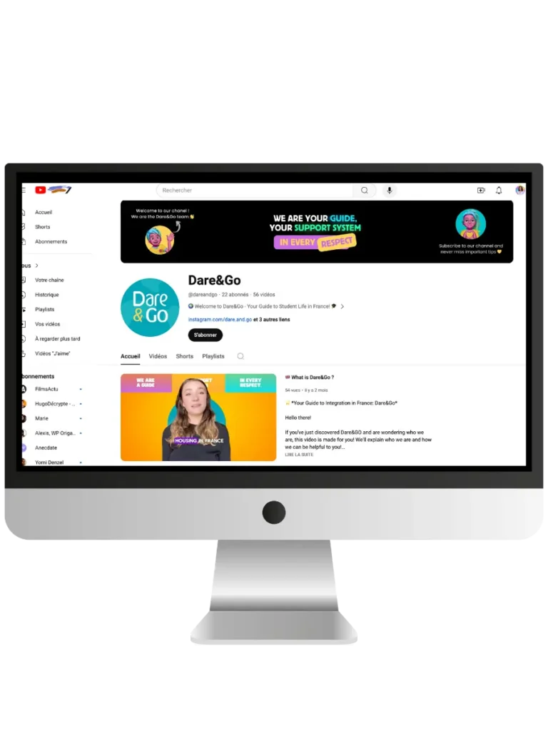 Monitor displaying the Dare&Go YouTube channel interface with various video thumbnails and an introductory banner.